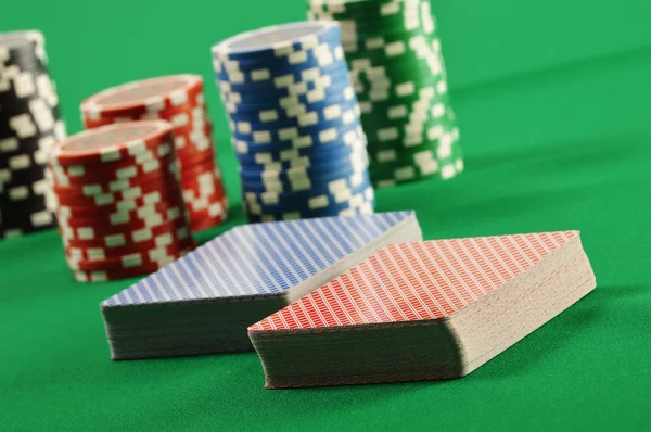 Composition with playing cards on green table — Stock Photo, Image