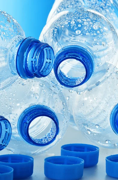 Composition with empty polycarbonate plastic bottles of mineral — Stock Photo, Image