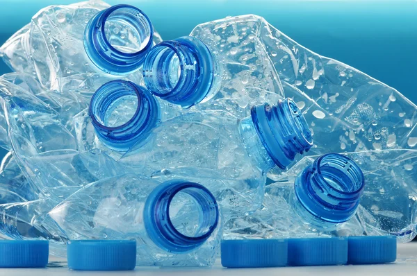 Composition with empty polycarbonate plastic bottles of mineral — Stock Photo, Image