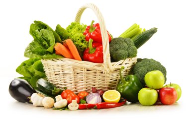 raw vegetables in wicker basket isolated on white clipart