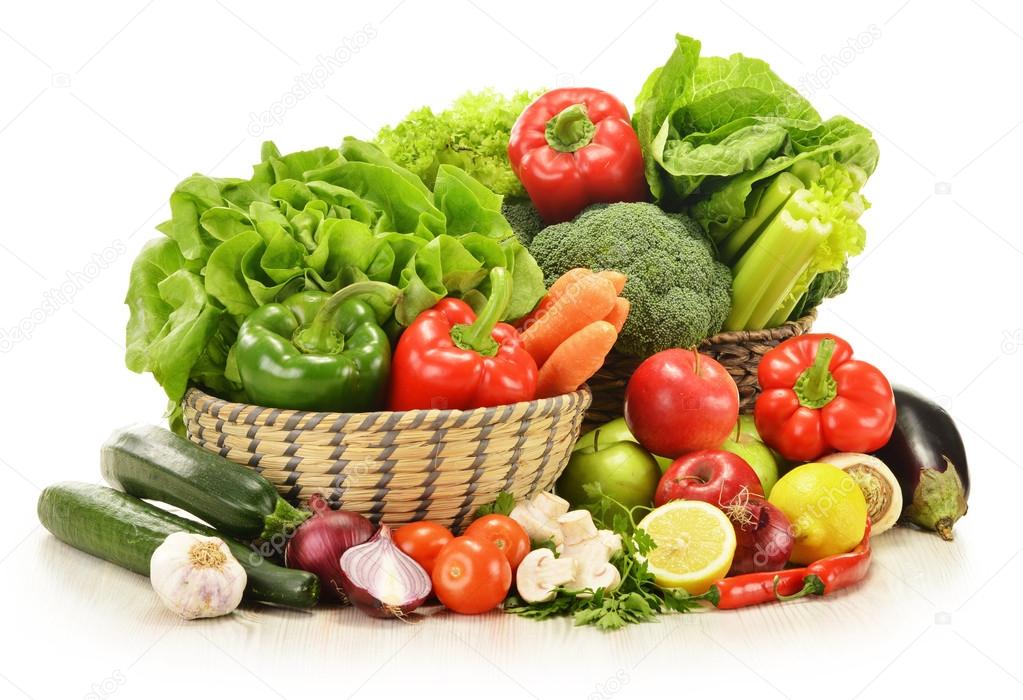 raw vegetables in wicker basket isolated on white