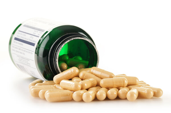 Composition with dietary supplement capsules. Drug pills