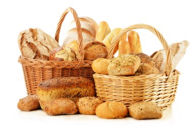 Bread and rolls in wicker basket isolated on white clipart
