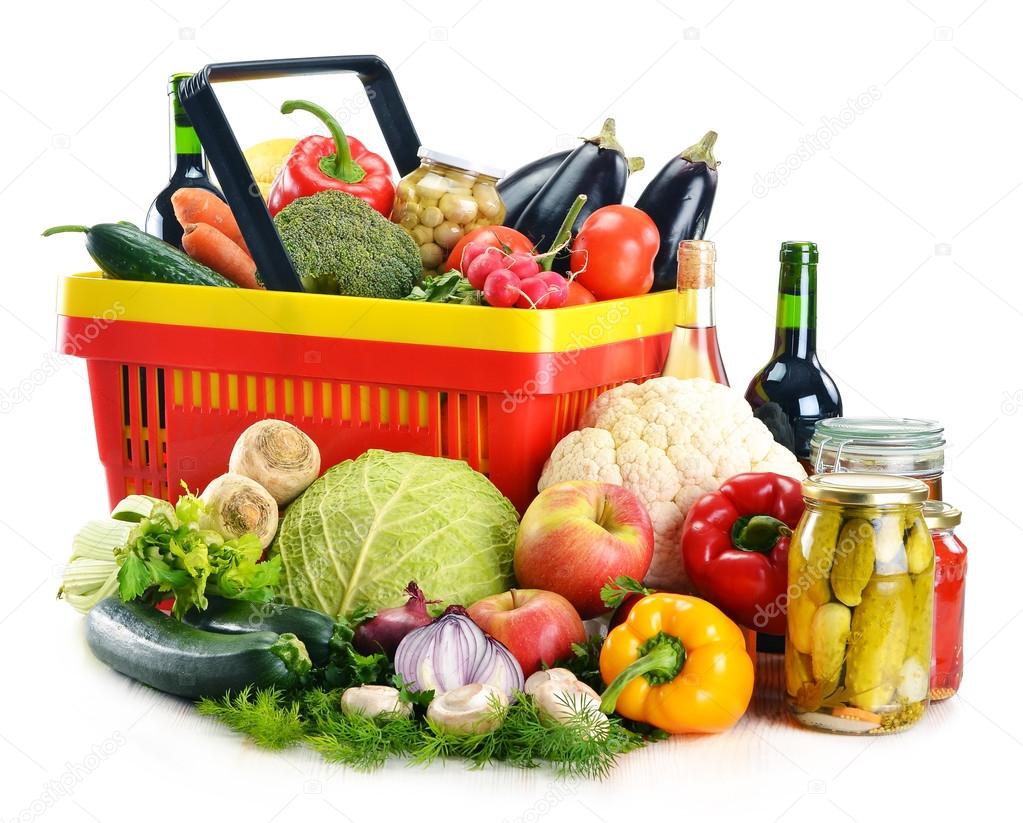 Plastic shopping basket and grocery isolated on white