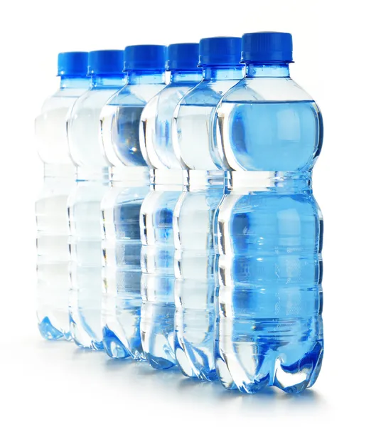 Composition with empty polycarbonate plastic bottles of mineral — Stock Photo, Image