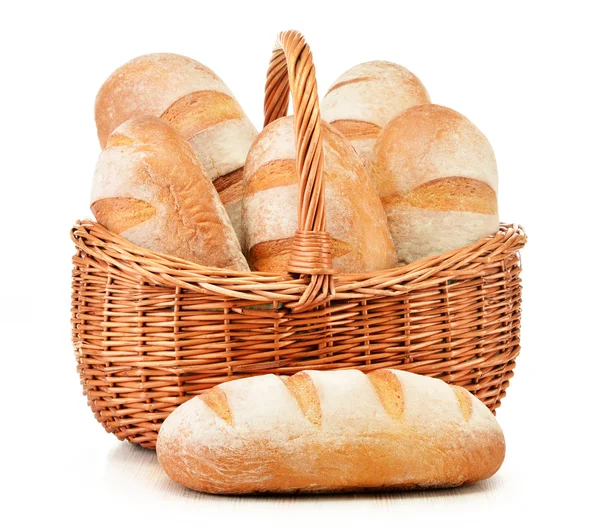 Loafs of bread in wicker basket isolated on white — Stock Photo, Image