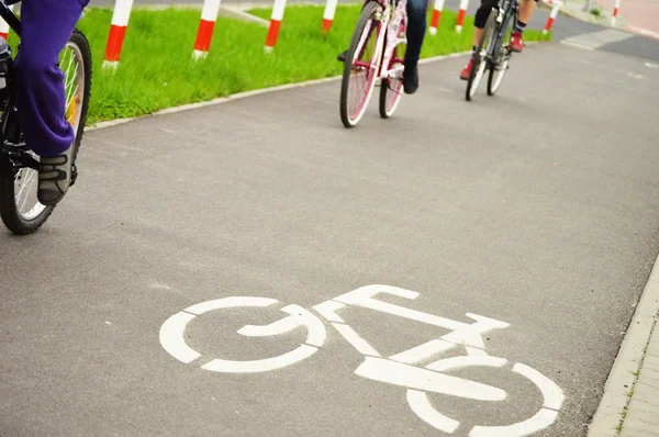 Bicycle road sign and bike rider — Stock Photo, Image