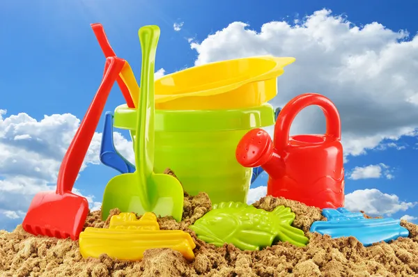 Plastic children toys over the blue sky — Stock Photo, Image