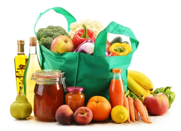 Green shopping bag with grocery products on white background — Stock Photo, Image