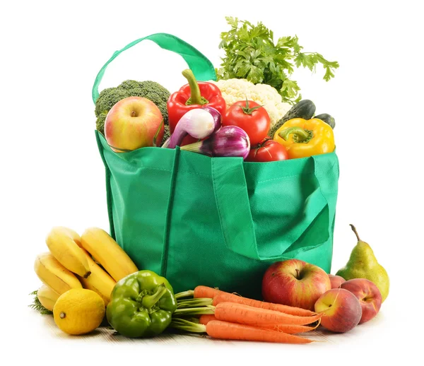 Green shopping bag with grocery products on white background — Stock Photo, Image