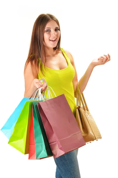 Young happy woman with colorful paper shopping bags isolated — Stock Photo, Image