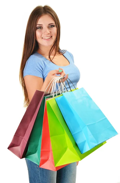 Młoda kobieta szczęśliwa z torby na zakupy Papier kolorowy na białym tle — Zdjęcie stockowe