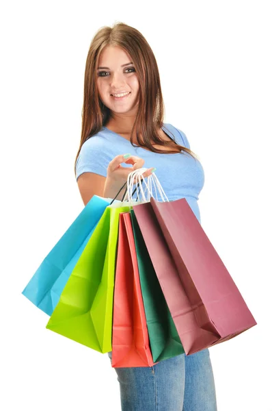 Mladá šťastná žena s barevné papírové nákupní tašky, samostatný — Stock fotografie