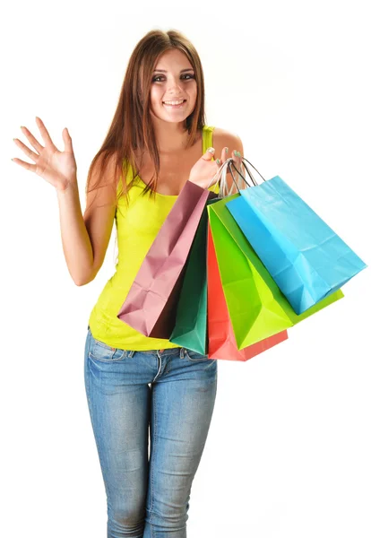 Młoda kobieta szczęśliwa z torby na zakupy Papier kolorowy na białym tle — Zdjęcie stockowe