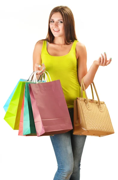 Mujer feliz joven con bolsas de compras de papel de colores aislados —  Fotos de Stock