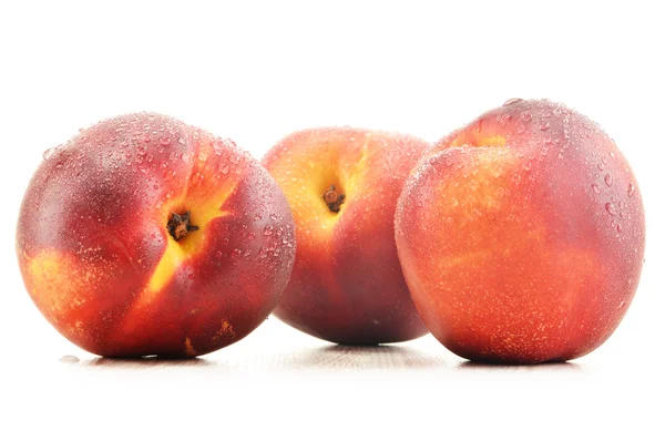 Three fresh nectarines isolated on white background — Stock Photo, Image