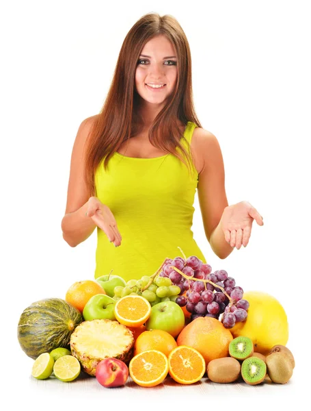 Mujer joven con frutas surtidas aisladas en blanco —  Fotos de Stock