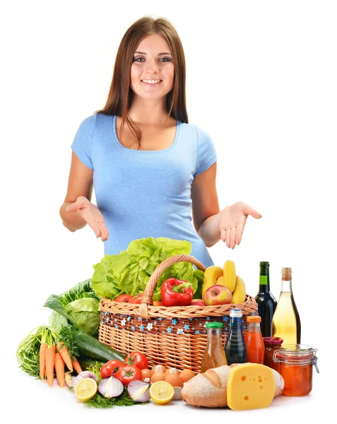 Young woman with assorted grocery products isolated on white — Stock Photo, Image