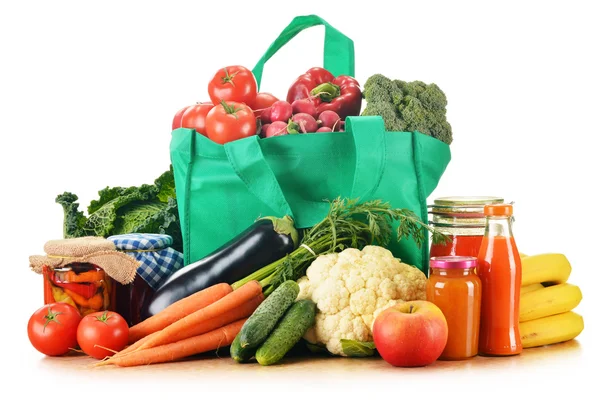 Green shopping bag with assorted grocery products isolated — Stok fotoğraf