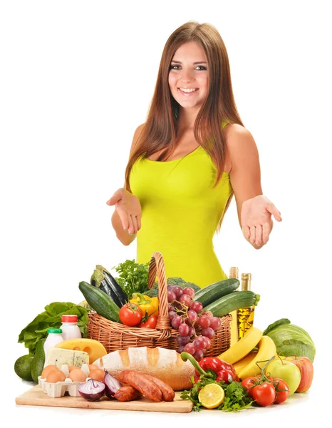 Young woman with assorted grocery products isolated on white Royalty Free Stock Images