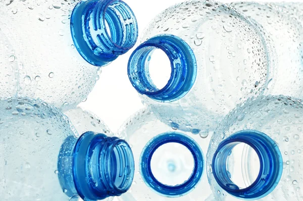 Composition with empty polycarbonate plastic bottles of mineral — Stock Photo, Image