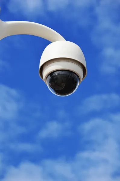 Hi-tech dome type camera over a blue sky — Stock Photo, Image