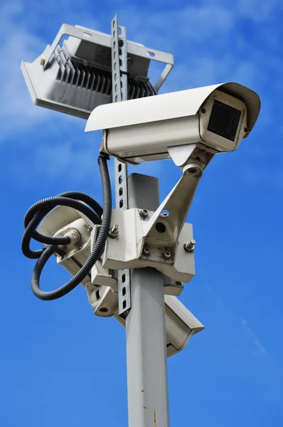 Hi-tech dome type camera over a blue sky — Stock Photo, Image