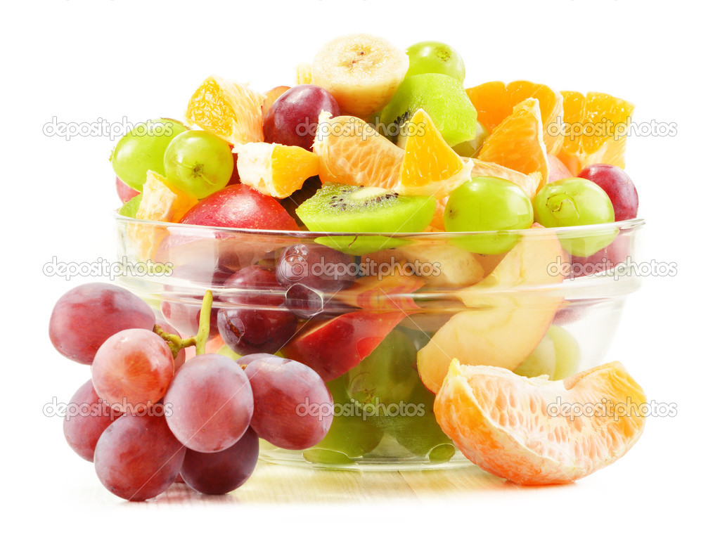 Fruit salad bowl isolated on white