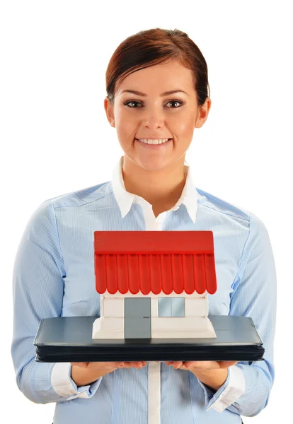 Young woman holding small house isolated on white — Stock Photo, Image