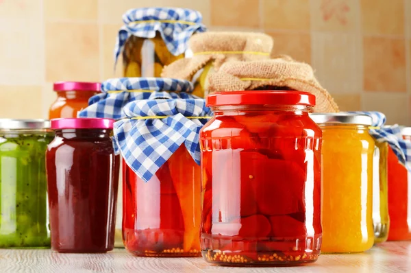 Jars of marinated food. Pickled vegetables and jams — Stock Photo, Image