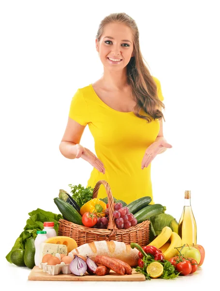 Young woman with assorted grocery products isolated on white — Stock Photo, Image