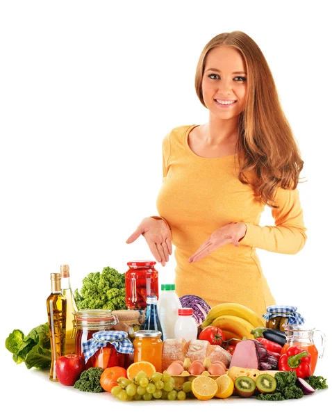 Young woman with assorted grocery products isolated on white Stock Photo