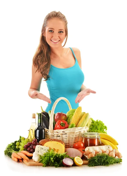 Young woman with assorted grocery products isolated on white Stock Picture