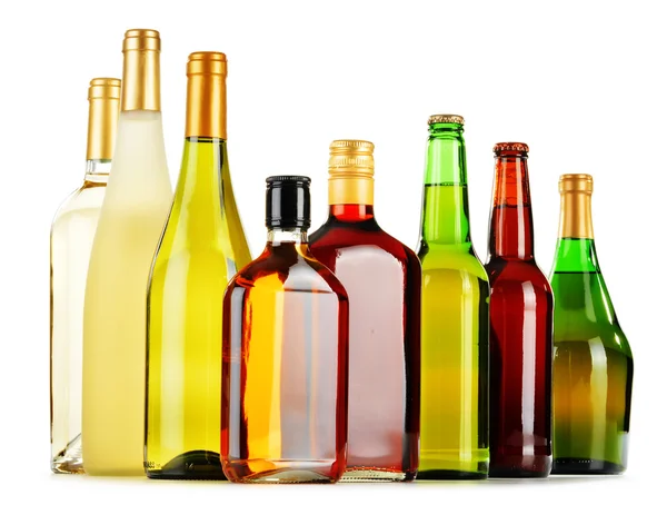 Bottles of assorted alcoholic beverages isolated on white — Stock Photo, Image