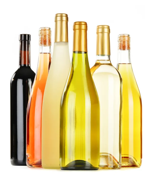 Composition with variety of wine bottles isolated on white — Stock Photo, Image