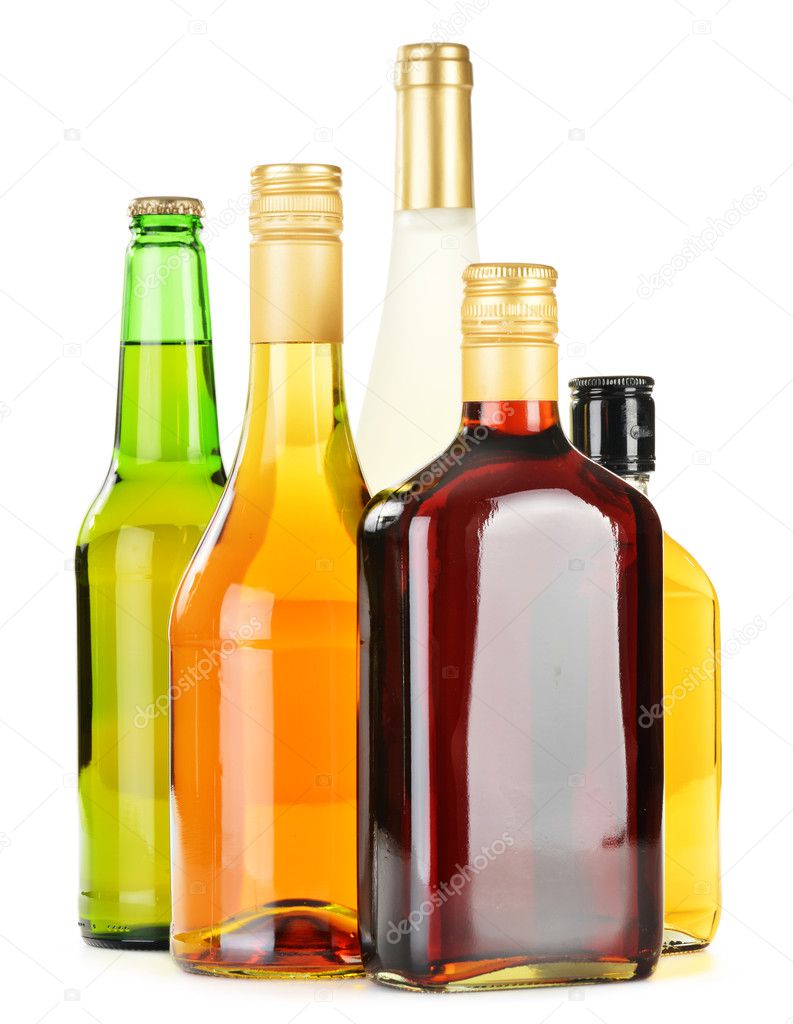 Bottles of assorted alcoholic beverages isolated on white