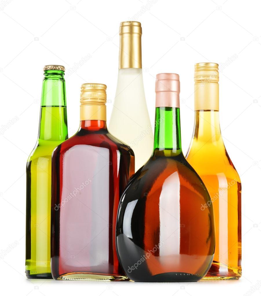 Bottles of assorted alcoholic beverages isolated on white