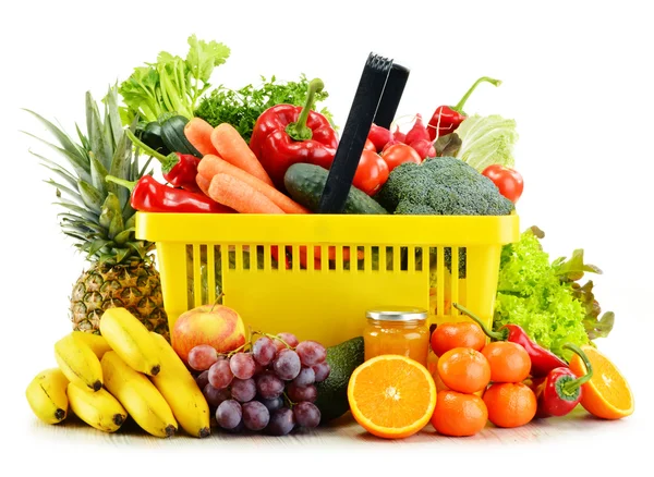 Plastic shopping basket with groceries isolated on white — Stock Photo, Image