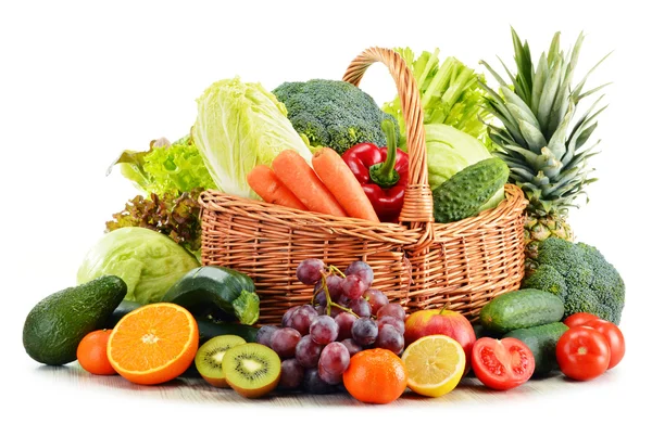 Wicker basket with groceries isolated on white — Stock Photo, Image