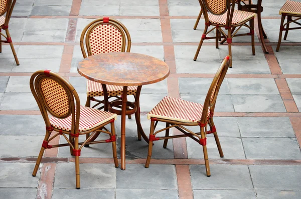 Tables and chairs in a street cafe — Stock Photo, Image