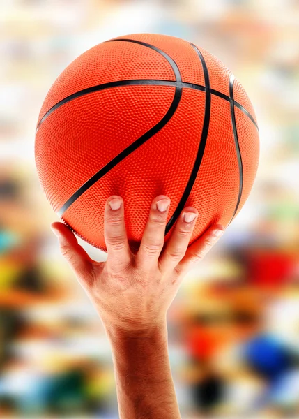 Hands catching basketball