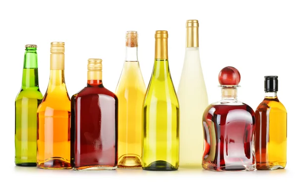 Bottles of assorted alcoholic beverages isolated on white — Stock Photo, Image