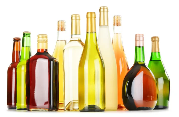 Bottles of assorted alcoholic beverages isolated on white — Stock Photo, Image
