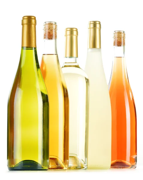 Composition with variety of wine bottles isolated on white Royalty Free Stock Images