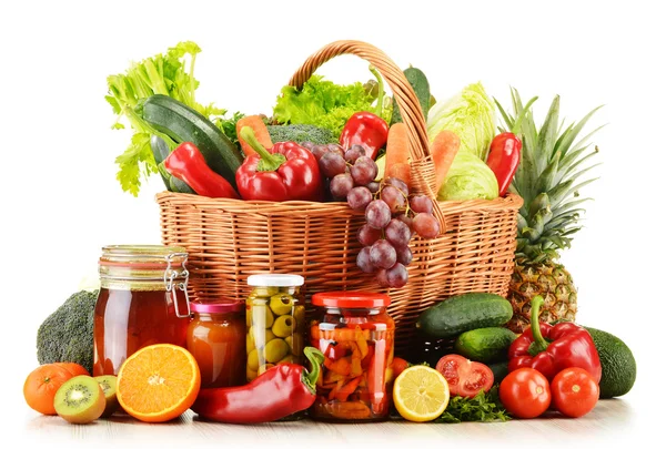 Wicker basket with groceries isolated on white — Stock Photo, Image