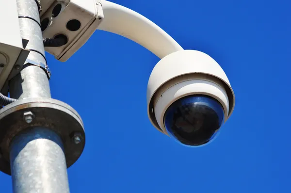 Hi-tech dome type camera over blue sky — Stock Photo, Image