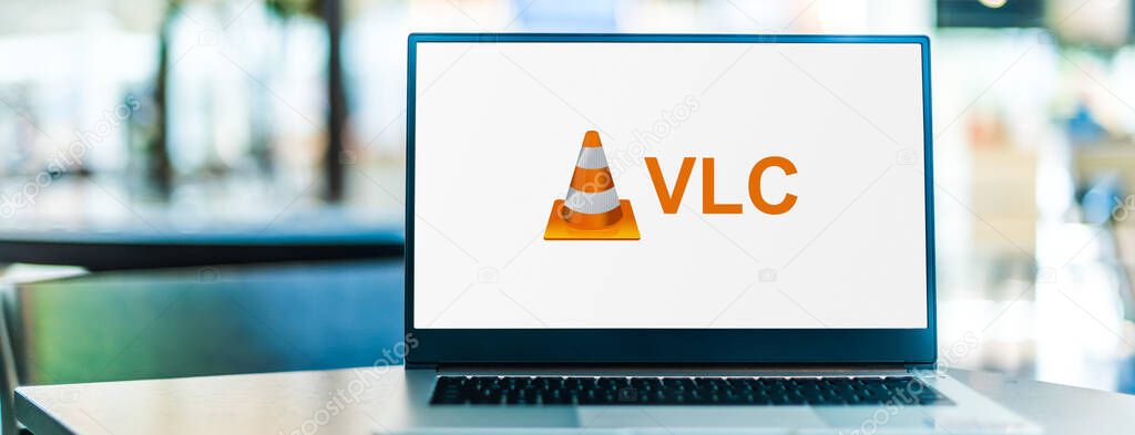 POZNAN, POL - SEP 23, 2020: Laptop computer displaying logo of VLC media player, a cross-platform media player software and streaming media server developed by the VideoLAN project