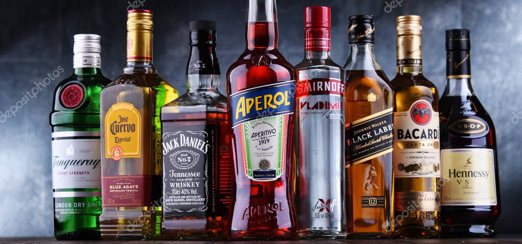 POZNAN, POL - OCT 27, 2021: Bottles of assorted global hard  liquor brands including whiskey, vodka, tequila and gin