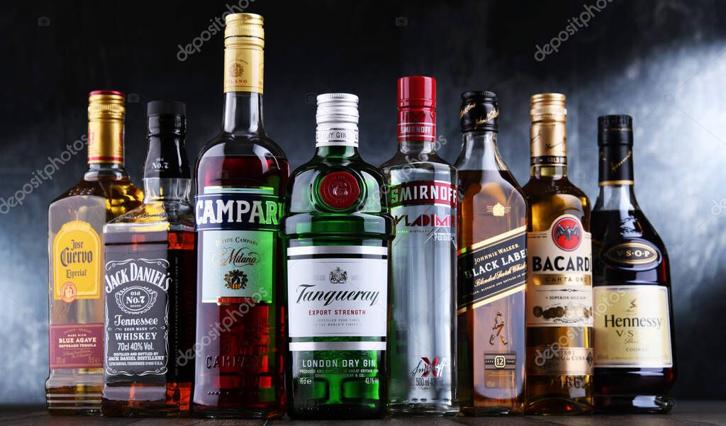 POZNAN, POL - OCT 27, 2021: Bottles of assorted global hard  liquor brands including whiskey, vodka, tequila and gin