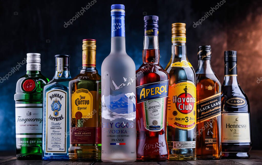 POZNAN, POL - OCT 27, 2021: Bottles of assorted global hard  liquor brands including whiskey, vodka, tequila and gin